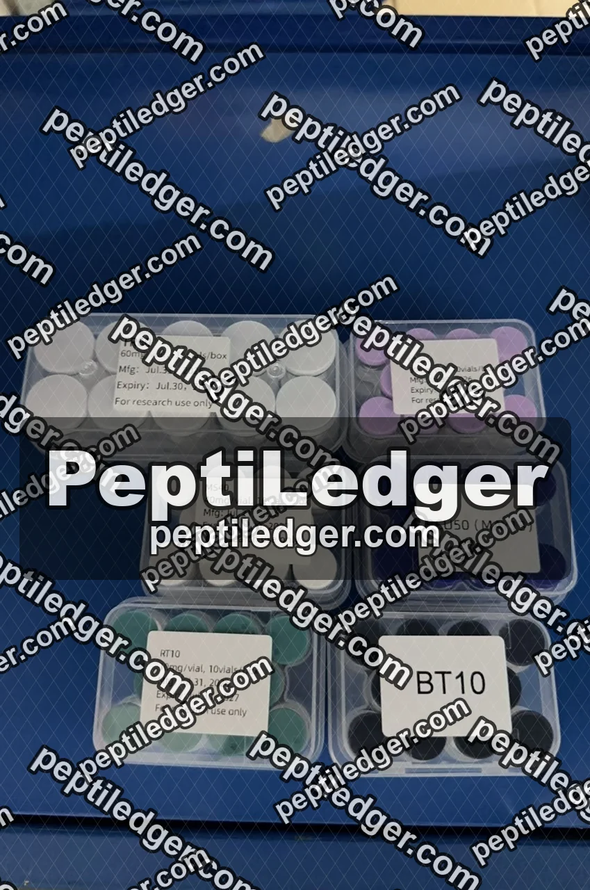 Six boxes of vials in a blue courier bag; most lids carry full labels with dates while one lid carries only the code BT10.