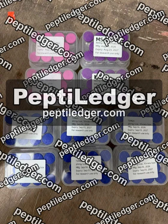 Boxes of pink- and blue-capped vials with lid labels